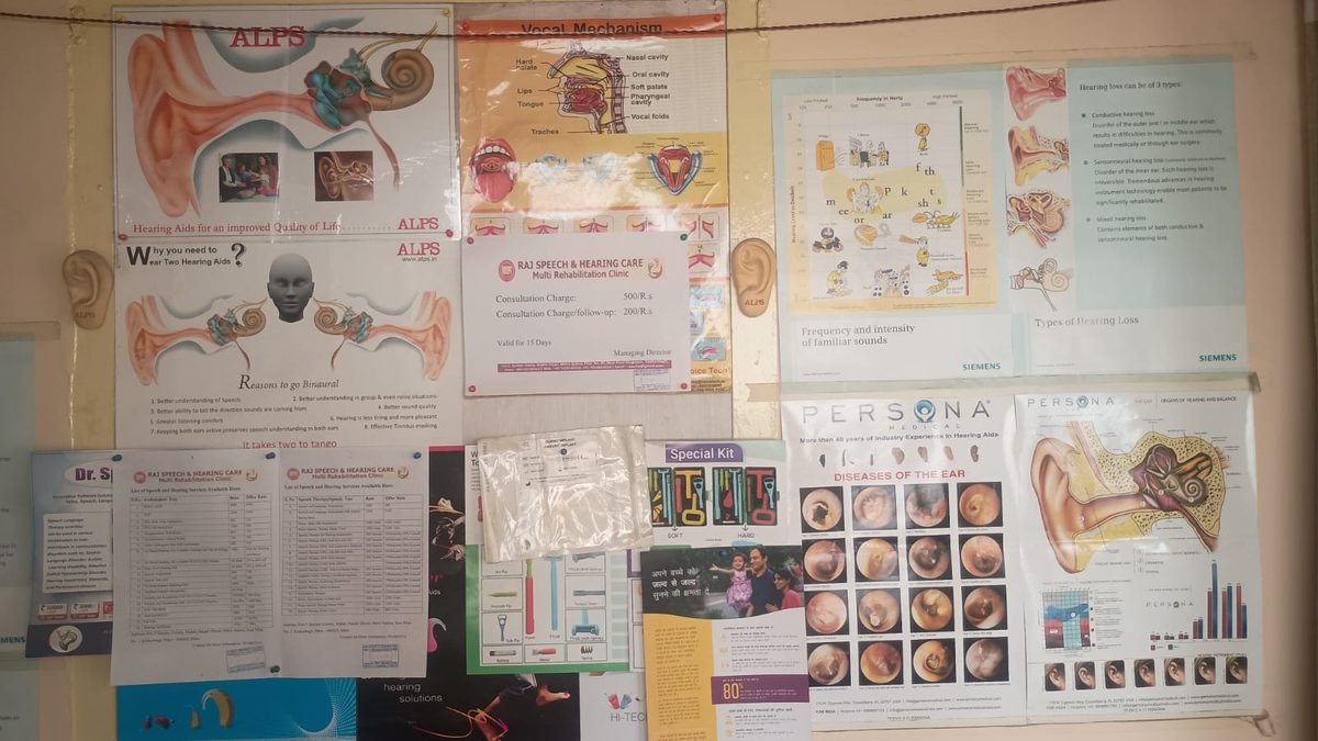 Educational hearing health posters on the clinic wall at Raj Speech and Hearing Care, Patna